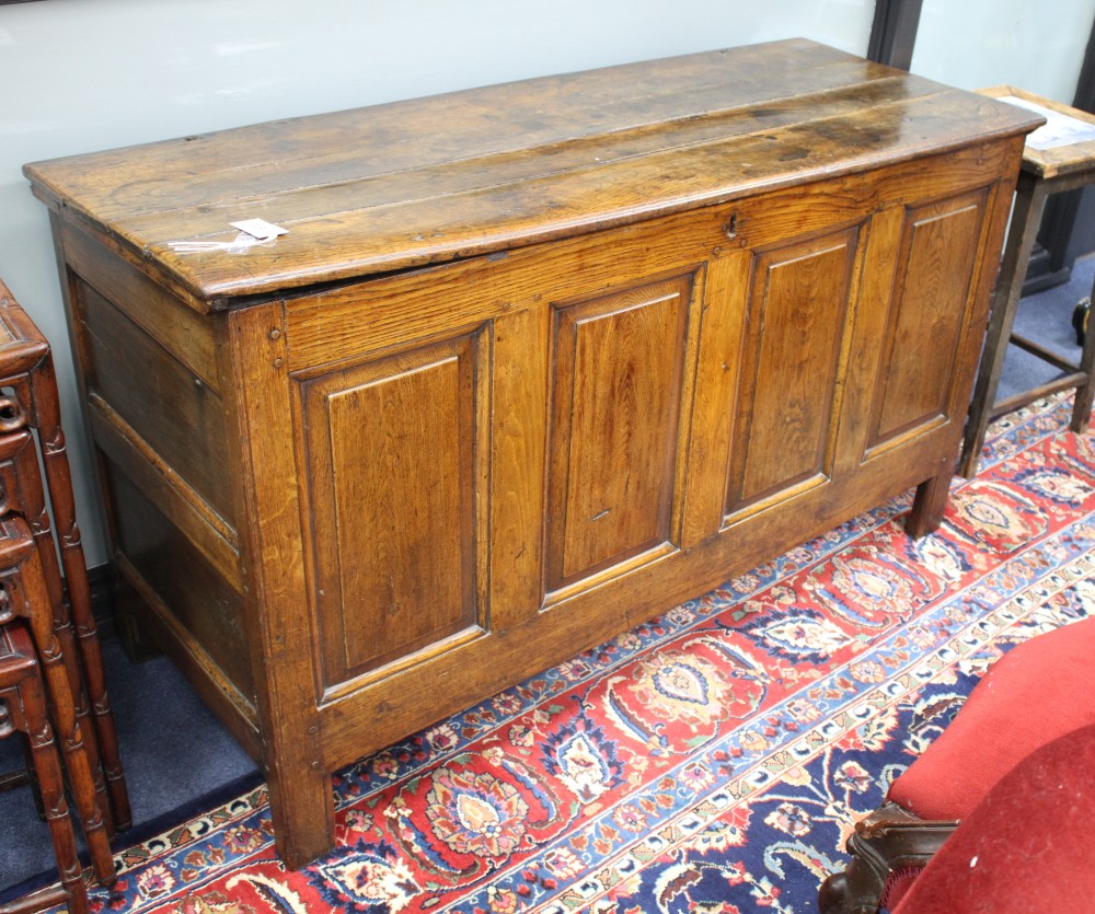 An 18th century oak panelled coffer, W.140cm D.53cm H.78cm